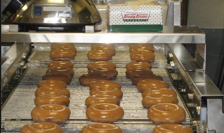 Krispy Kreme giving a free dozen with a dozen purchase (Image 1)_56989