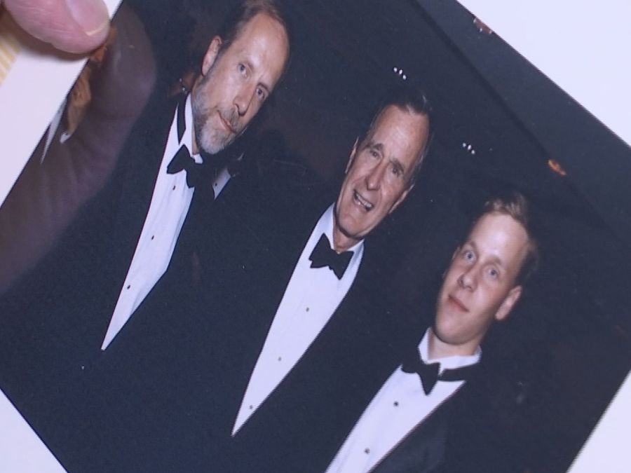 George H. W-846624087. Bush pictured with Charles Bierbauer and son