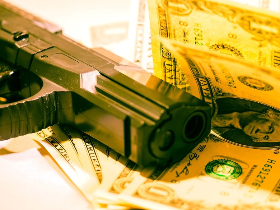 armed robbery money gun dollar crime.jpg