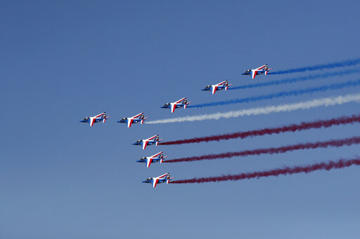 French President Emmanuel Macron, French Defence Minister Florence Parly and Eric Trappier, Chairman and CEO of Dassault Aviation, attend the 53rd International Paris Air Show at Le Bourget