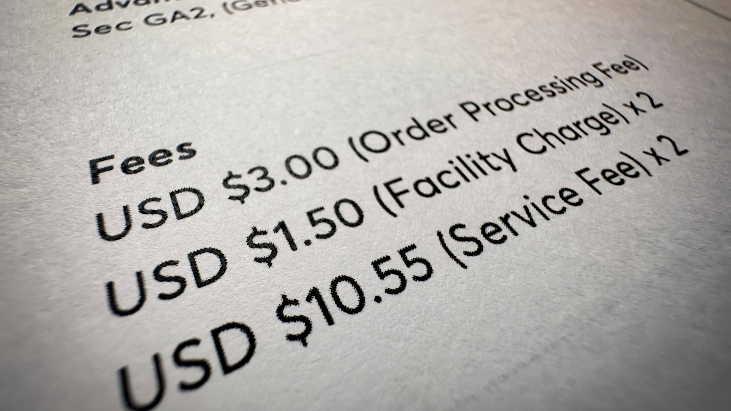 Fees on a concert ticket receipt are shown in this photo taken Wednesday, Nov. 1, 2023, in New York. "Junk fees" are just what they sound like: hidden or misleading charges that increase the total cost of concert tickets, hotel rooms, utility bills and other goods and services. (AP Photo/John Minchillo)