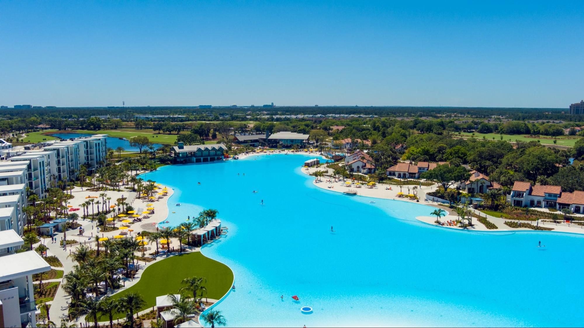 Vacation homes and villas surround an artificial beach at Evermore Orlando Resort, which recently expanded its Hilton partnership. (Photo courtesy of Evermore Orlando Resort)